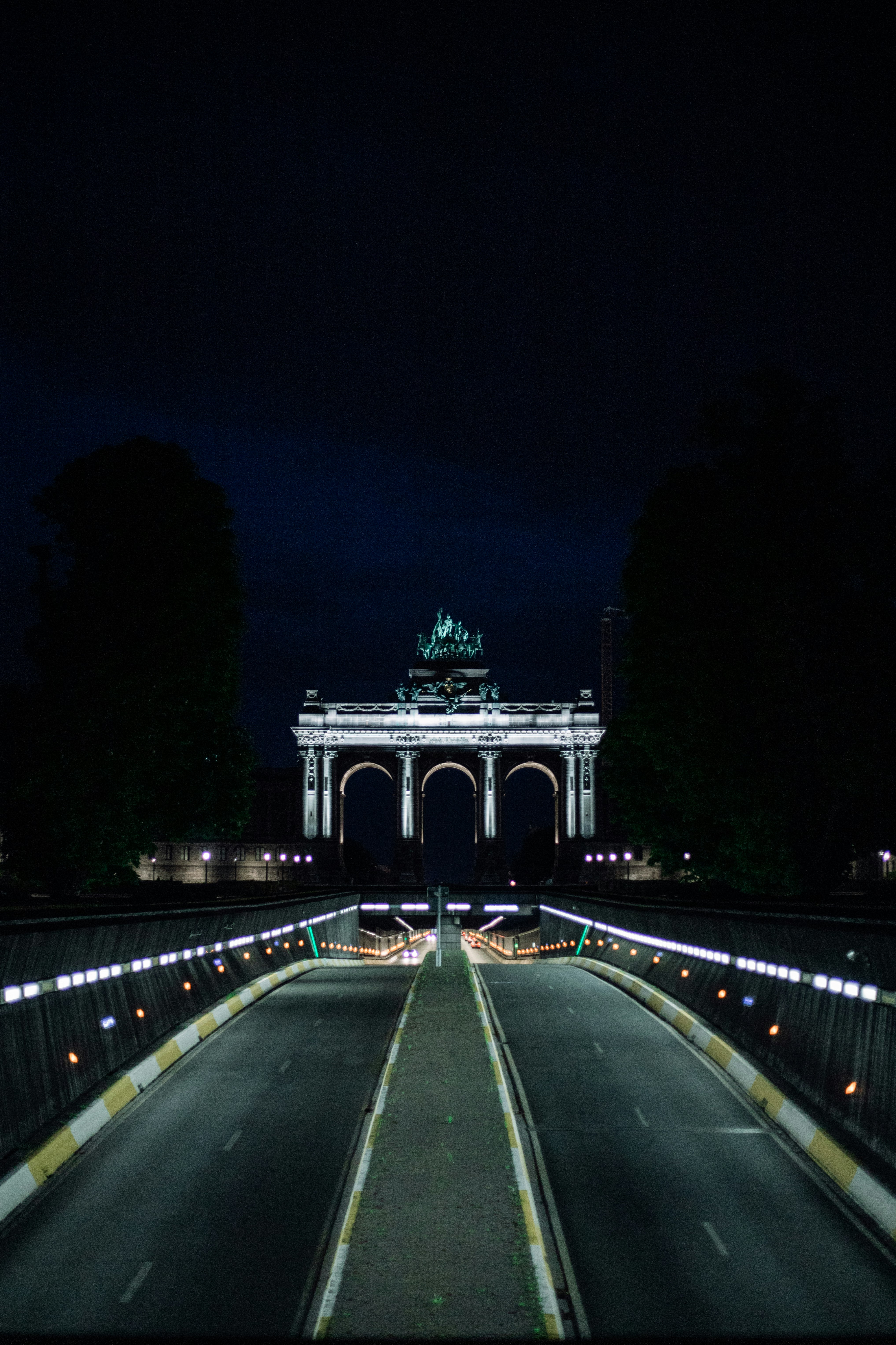 gray concrete bridge during night time